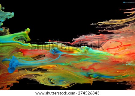 Colorful ink swirling through water