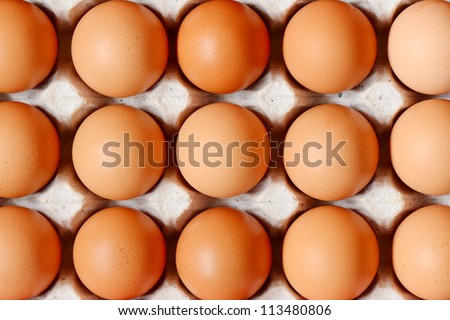 Chicken eggs on tray in supermarket.