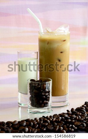 Iced coffee with milk and crisp coffee beans.