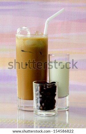 Iced coffee with milk and crisp coffee beans.