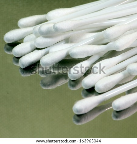 Sterile cotton swabs on sterile aluminum tray.