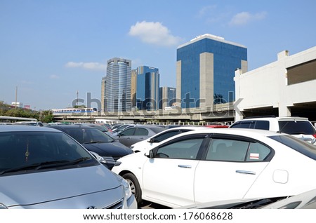 BANGKOK, THAILAND - FEBRUARY 7, 2014: Full public cars parked at a park at a BTS station in Chatuchak station.