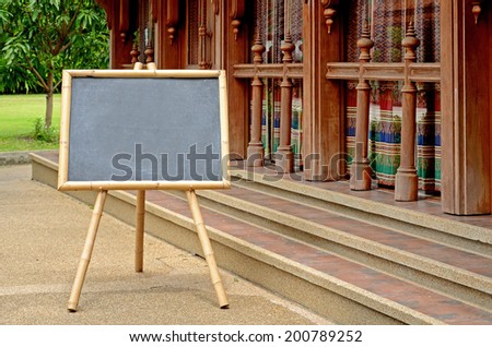 Blank Chalkboard with Bamboo Wood Stand Outdoor.