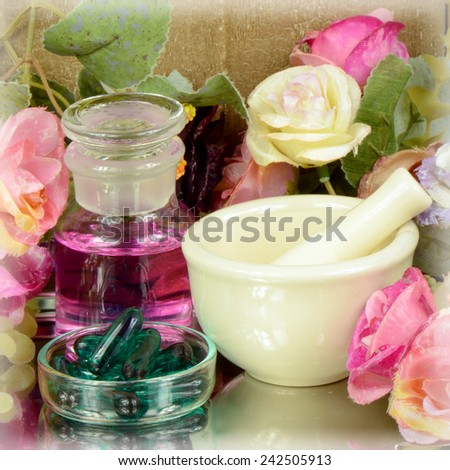 Herbal medicine products and medicine grinder on floral background in medicine from natural product concept.