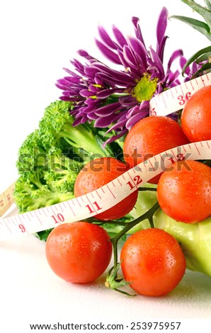Fruits, Vegetable and Tape Measure on White Background in Waistline and Weight Control Concept with Food Control.