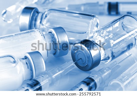 Tuberculin Syringe and Sterile Vial Filled with Medication Solution. An Injection Pharmaceutical Dosage Form.