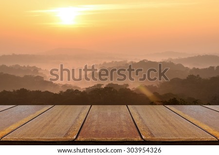 Blurred Sunrise Background and Mountain Landscapewith with Perspective Wood Window View.