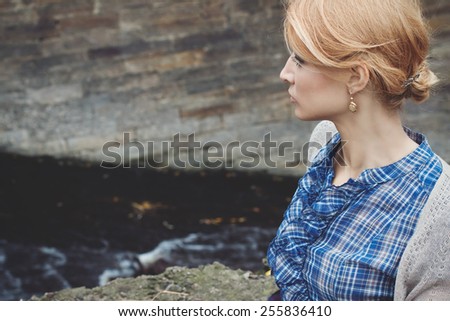 Close-up portrait in profile of beautiful girl in vintage style on nature background