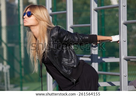 Pretty woman with long hair engaged in physical activity on the playground
