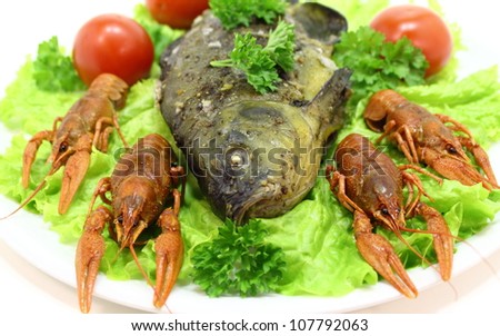 dish with crayfish smoked fish,salad and tomato