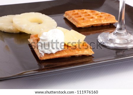 Pineapple Tart Slices with fresh vanilla cream on white dish