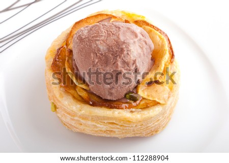 Apple pie dessert with chocolate ice cream on white dish