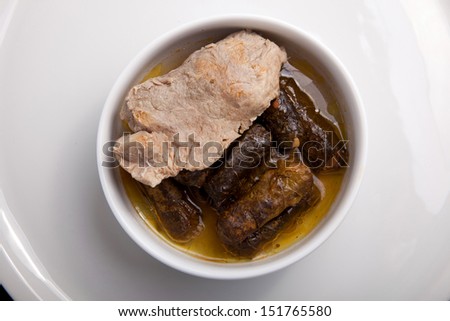 Meat with stuffed grape leaves with lemon sauce, turkish, Arabian and greek cuisine