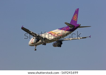 THAILAND - JANUARY 4 2013: HS-TXD Airbus 320-200 of Thai smile airline, New airline of thailand ,short and region destination around thailand, Photo landing to chiangmai from phuket, thailand.