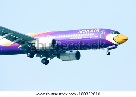 CHIANGMAI ,  THAILAND Ã¢Â?Â? DECEMBER  31  2011: HS-DBB  Boeing 737-800 of NokAir  ( Low-cost Airline ), Landing to Chiangmai airport  from Bangkok  Don Muang Airport.