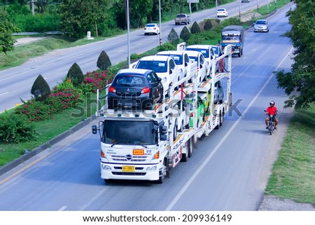 CHIANGMAI, THAILAND - MAY 21 2014 : NYK Auto Logistics thailand carrier trailer. Photo at Road No.11 about 5 Km from Chiangmai city.