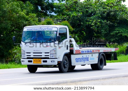 CHIANGMAI , THAILAND - AUGUST 22 2014:  Slide up tow truck for emergency car move of Jongjareun sab company. Photo at road no 121 about 8 km from downtown Chiangmai, thailand.