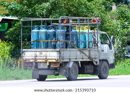 CHIANGMAI , THAILAND - AUGUST 22 2014: Gas truck of Unique gas company. Photo at road no 121 about 8 km from downtown Chiangmai, thailand.