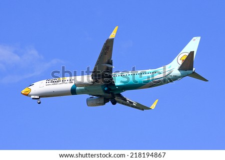 CHIANGMAI , THAILAND - SEPTEMBER 10 2014: HS-DBO Boeing 737-800 of NokAir ( Low-cost Airline ), Landing to Chiangmai airport from Bangkok Don Muang Airport.