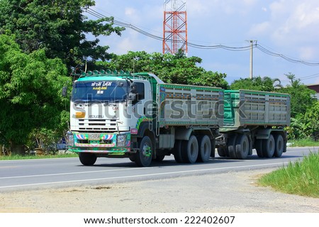 CHIANGMAI, THAILAND - OCTOBER 3 2014: Trailer dump truck. Photo at road no.121 about 8 km from downtown Chiangmai, thailand.