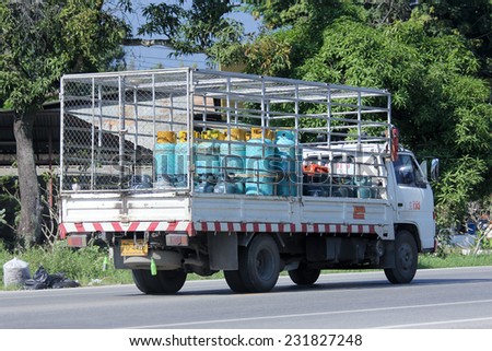 CHIANGMAI , THAILAND -NOVEMBER 13 2014:  Gas truck of Unique gas company. Photo at road no 121 about 8 km from downtown Chiangmai, thailand.