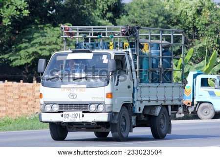 CHIANGMAI , THAILAND -NOVEMBER 20 2014: Gas truck of Unique gas company. Photo at road no 121 about 8 km from downtown Chiangmai, thailand.