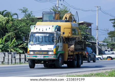 CHIANGMAI, THAILAND - NOVEMBER 24 2014: Truck and backhoe of Norst Star Group. Photo at road no.121 about 8 km from downtown Chiangmai, thailand.