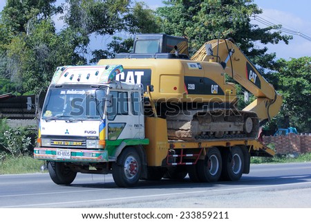 CHIANGMAI, THAILAND - NOVEMBER 24 2014: Truck and backhoe of Norst Star Group. Photo at road no.121 about 8 km from downtown Chiangmai, thailand.