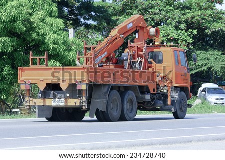 CHIANGMAI, THAILAND - OCTOBER 2 2014: Truck with crane of Provincial eletricity Authority of Thailand. Photo at road no.121 about 8 km from downtown Chiangmai, thailand.