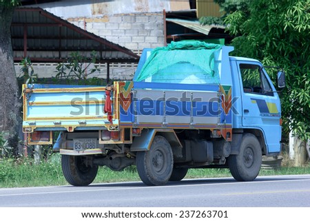 CHIANGMAI , THAILAND - OCTOBER 6 2014: Private dump truck. Photo at road no.121 about 8 km from downtown Chiangmai, thailand.