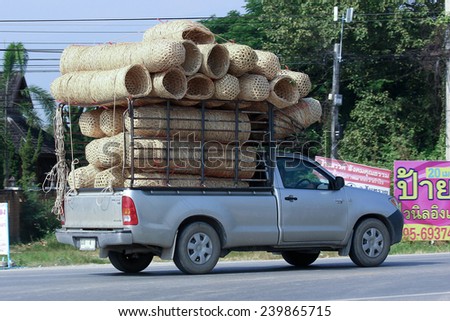 CHIANGMAI, THAILAND -OCTOBER 18 2014: Private mini truck for Transportation Bamboo Bucket. Photo at road no.121 about 8 km from downtown Chiangmai, thailand.