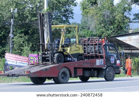 CHIANGMAI, THAILAND -OCTOBER 25 2014:  Nam Jaruen Tow truck for emergency car move. Photo at road no 121 about 8 km from downtown Chiangmai, thailand.