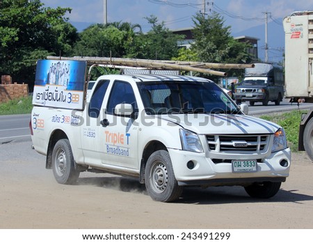 CHIANGMAI, THAILAND - NOVEMBER 11 2014:  Pickup truck of Triple T Broadband company. Intenet Service in Thailand. Photo at road no 121 about 8 km from downtown Chiangmai, thailand.