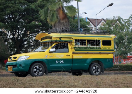 CHIANGMAI, THAILAND - DECEMBER 3 2014:   Yellow and Green taxi Lampang, Service in city and around. Photo at road no.11 about 3 km from downtown of Lampang, thailand.