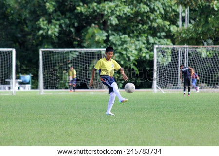 CHIANGMAI, THAILAND- -JULY 12 2014 Young Football Player  of CHIANGMAI FOOTBALL CLUB 700 YEAR. Photo at Mini football field of 700 Year Main Stadium,Chiangmai thailand.