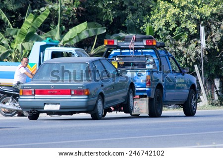 CHIANGMAI , THAILAND - DECEMBER 9 2014:  Prasert Yorn Tow truck for emergency car move. Photo at road no 121 about 8 km from downtown Chiangmai, thailand.