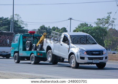 CHIANGMAI , THAILAND - DECEMBER 20 2014: SayThong Tow truck for emergency car move. Photo at road no 1001 about 8 km from downtown Chiangmai, thailand.