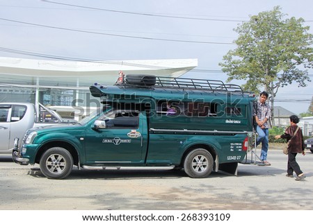 CHIANGMAI, THAILAND -JANUARY 15 2015: Passenger of Green mini truck taxi chiangmai, Service between city and Sansai district. Photo at road no.1001 about 8 km from downtown Chiangmai, thailand.