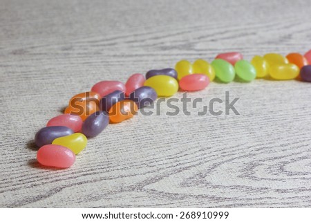 Candies on Wood Background