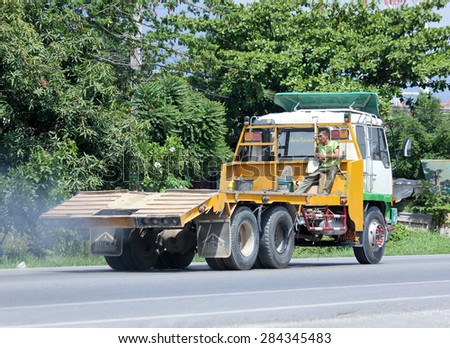 CHIANGMAI, THAILAND - JUNE 4 2015: Truck for transport backhoe of Norst Star Group. Photo at road no.121 about 8 km from downtown Chiangmai, thailand.