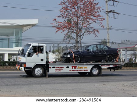 CHIANGMAI , THAILAND -FEBRUARY 16 2015:   Slide up tow truck for emergency car move, TR Slide on Company. Photo at road no.1001 about 8 km from downtown Chiangmai, thailand.