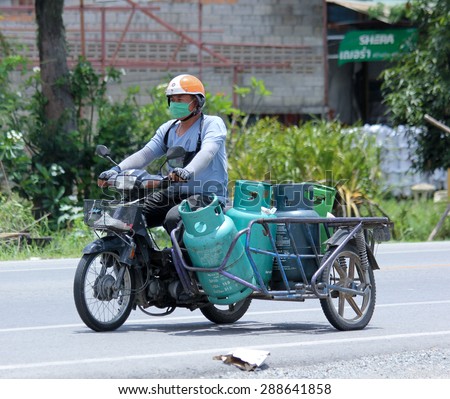 CHIANGMAI, THAILAND -JUNE 16 2015: Private Motorcycle for delivery gas lpg to home.  Photo at road no 121 about 8 km from downtown Chiangmai, thailand.