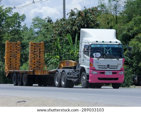 CHIANGMAI , THAILAND -JUNE 19  2015: Trailer truck for move backhoe of Thanachai Company. Photo at road no.1001 about 8 km from downtown Chiangmai, thailand.
