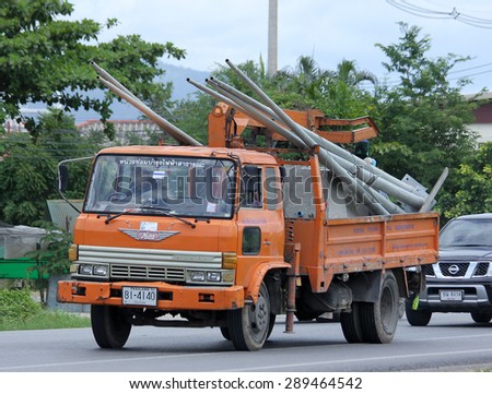 CHIANGMAI , THAILAND -JUNE 22 2015:   Bucket truck of Provincial eletricity Authority of Thailands. Photo at road no.1001 about 8 km from downtown Chiangmai, thailand.