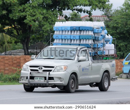 CHIANGMAI, THAILAND -JUNE 25 2015:   Drinking water delivery Pickup  truck of Dewdrop company. Photo at road no.121 about 8 km from downtown Chiangmai, thailand.
