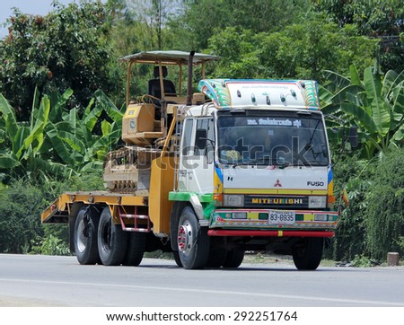 CHIANGMAI , THAILAND -JUNE 29 2015: Truck and backhoe of Norst Star Group. Photo at road no.121 about 8 km from downtown Chiangmai, thailand.