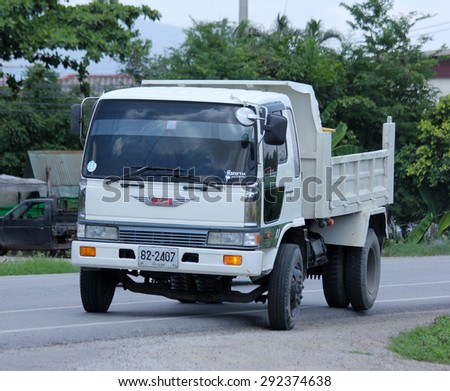 CHIANGMAI , THAILAND -JUNE 29 2015:  Private Hino dump truck. Photo at road no.1001 about 8 km from downtown Chiangmai, thailand.