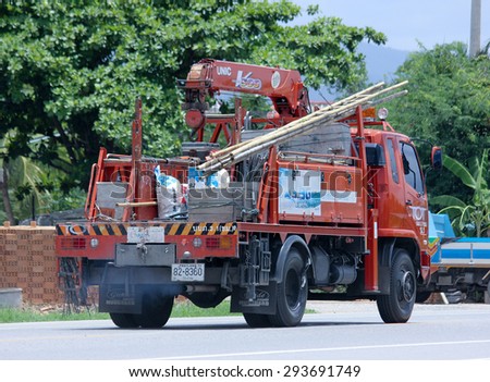 CHIANGMAI, THAILAND -JUNE 30 2015: Truck with crane of Tot company.Intenet and Telephone Service in Thailand.  Photo at road no.1001 about 8 km from downtown Chiangmai, thailand.