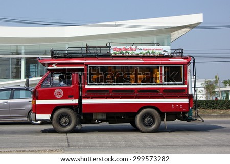 CHIANGMAI , THAILAND- FEBRUARY  5 2015: Orange truck taxi chiangmai, Service between city and Phrao district. Photo at road no.1001 about 8 km from downtown Chiangmai, thailand.
