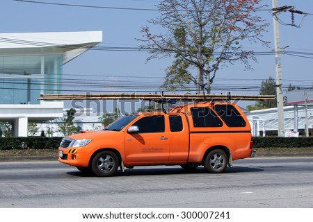 CHIANGMAI , THAILAND- FEBRUARY 5 2015: Pickup truck of CAT Telecom Public Company Limited. Intenet and Telephone Service in Thailand. Photo at road no 121 about 8 km from downtown Chiangmai, thailand.